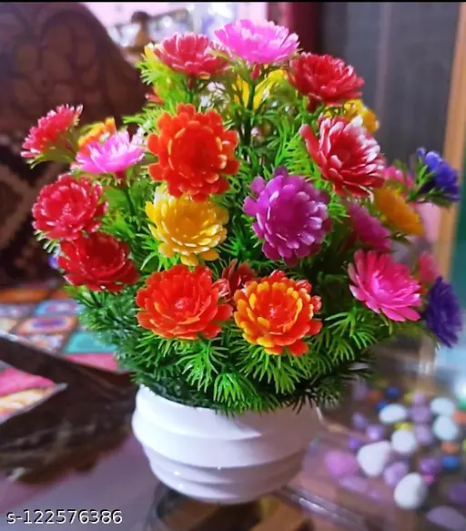 Multicolour flowers plant for home decoration pair set of 1 small table plant for office ,balcony ,dining table.good quality product for home. Multicolor Daisy Artificial Flower with Pot